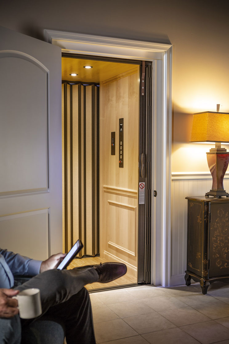 woman in home elevator surrounded by glass